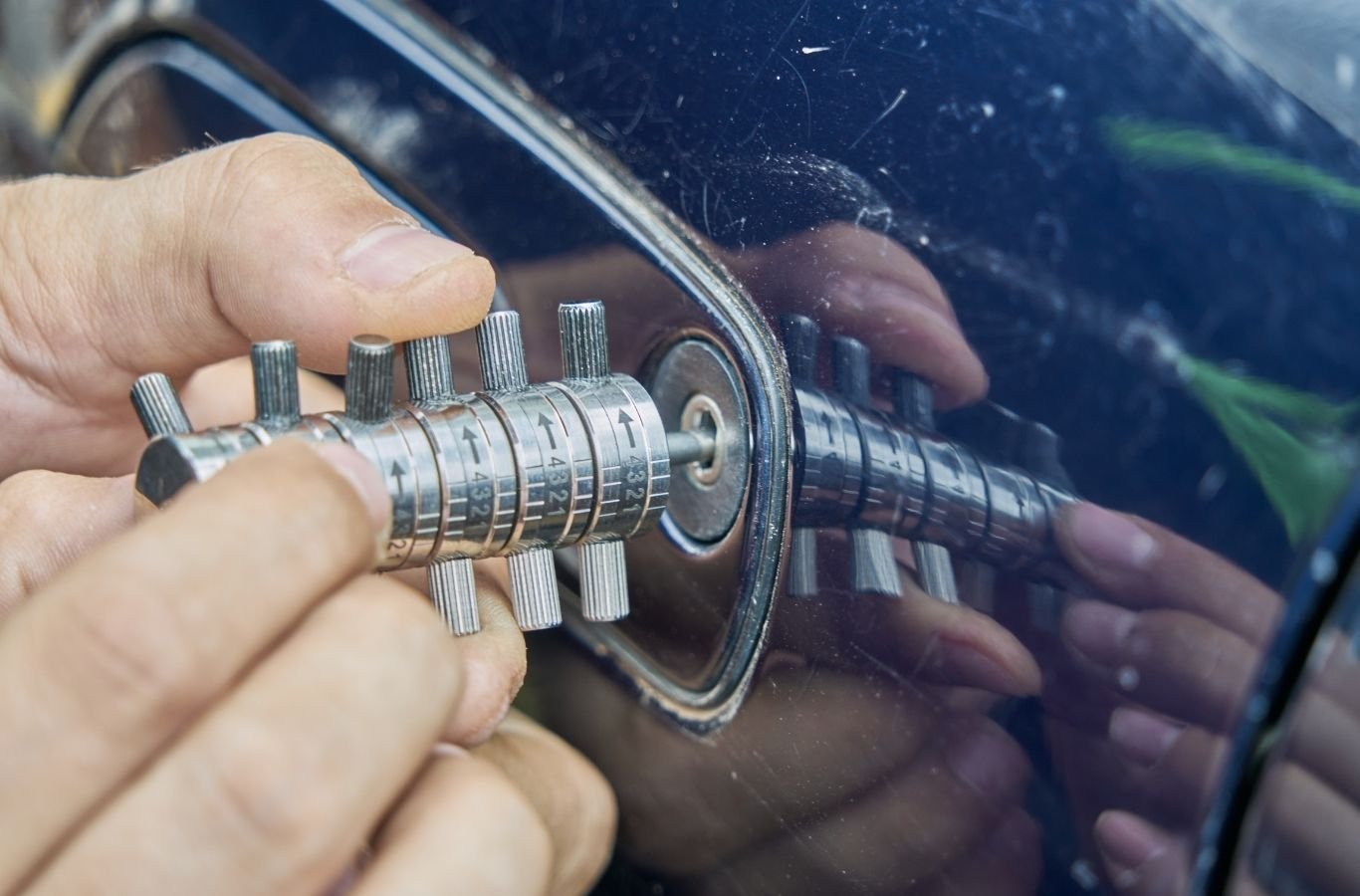 Emergency locksmith unlocking a car for a driver in a Hope Mills parking lot