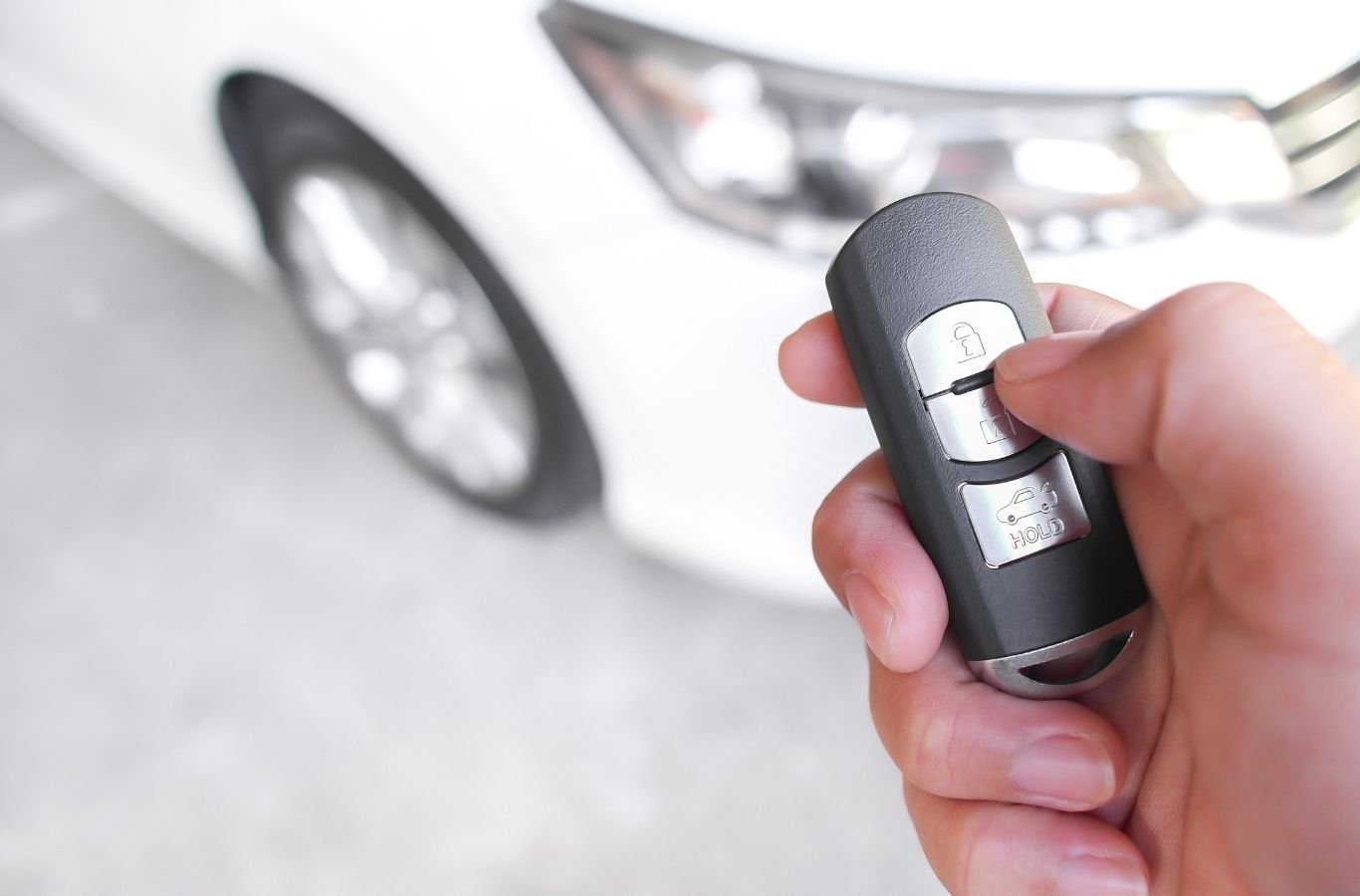 Locksmith unlocking stranded driver's car door outside Stedman grocery store
