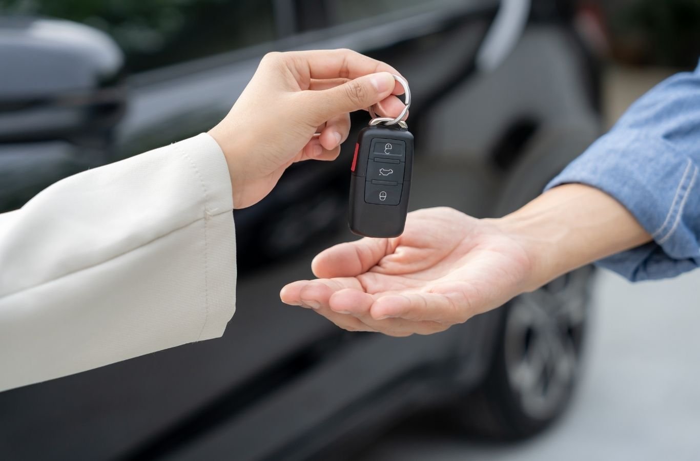 Locksmith unlocking stranded driver's car in Hope Mills shopping center parking lot